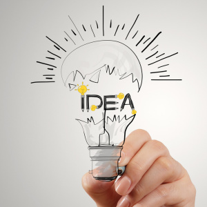 hand drawing light bulb and IDEA word design as concept